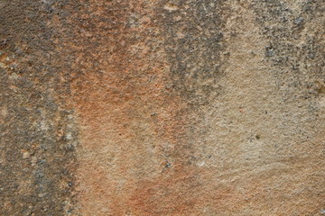 Texture of an old wall. Surface of an ancient temple in Prague. Background of stone for the designer. Vintage pattern in brown tones