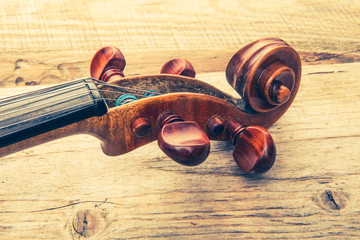 violin on a table of rough boards