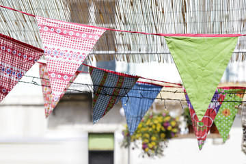Decorations of colorful fabric pennants and flags
