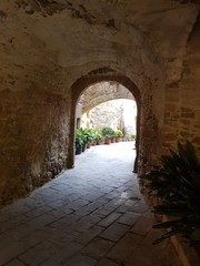 Fototapeta na wymiar Outside the arch, nice courtyard at Monells, Catalonia