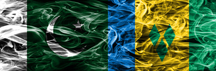 Pakistan vs Saint Vincent and the Grenadines smoke flags placed side by side. Thick colored silky...