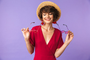 Portrait of a lovely young girl in straw hat