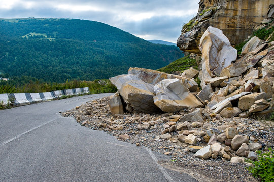 Rockfall on the road in the mountains.