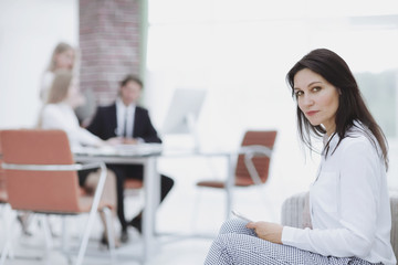 Fototapeta premium serious business woman sitting in his office.
