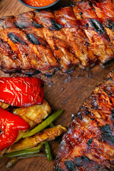 Ribs With Grilled Vegetables Closeup. Barbecue Meat