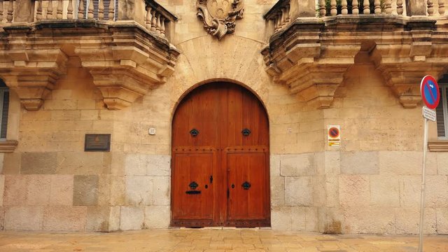 A Wooden door of a medieval building. Spain.