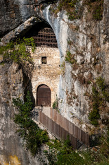 Cave below Predjama castle. Prison door