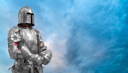 Knight in helmet and metal armor.
