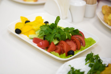 Tomato salad on the table. Vegetable Food for vegetarians. 