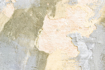 a piece of old plaster in gray and pink tones