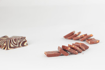 slices of original milk chocolate .isolated on white