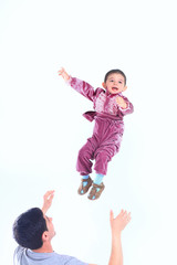 happy father playing with his son who is dressed in a Gypsy costume