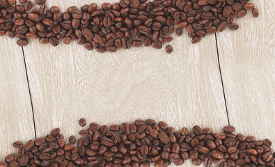 funny face of black coffee beans on wooden background