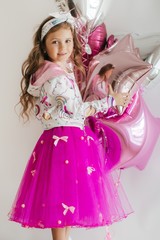 Little happy girl in  fashion dress