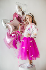 Little happy girl in  fashion dress