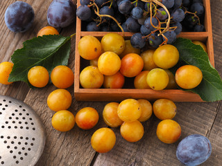 Mirabelles, plums and grapes, healthy food