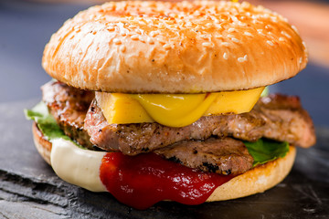 burger with steak and flowing sauces