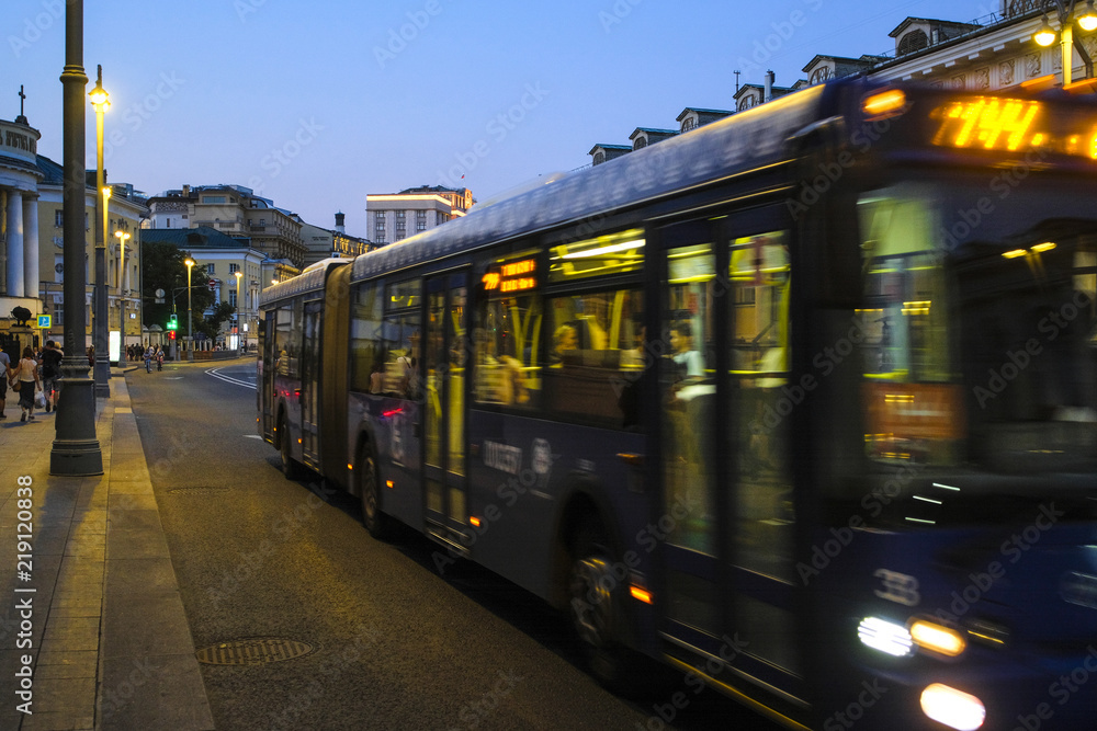 Poster moscow, russia - august, 19, 2018: bus on night street in a center of moscow