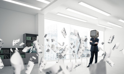 Businessman with an old TV instead of head.