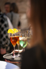 Waiter serving champagne on a tray