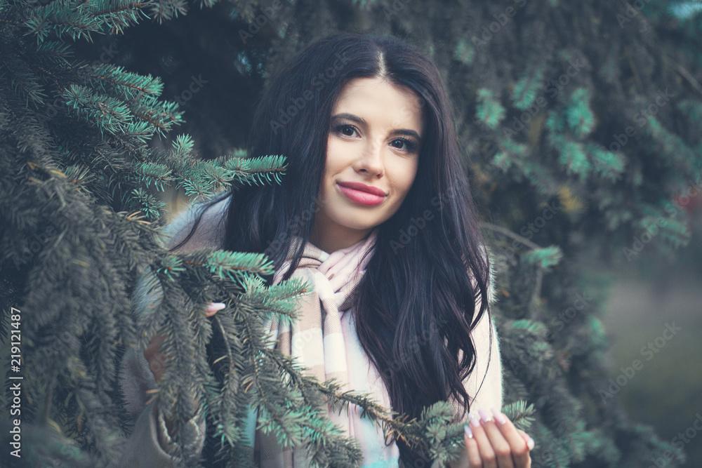 Wall mural Smiling woman outdoors. Beautiful brunette girl portrait