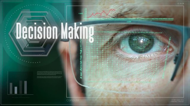 A close up of a businessman eye controlling a futuristic computer system with an Decision Making concept.
