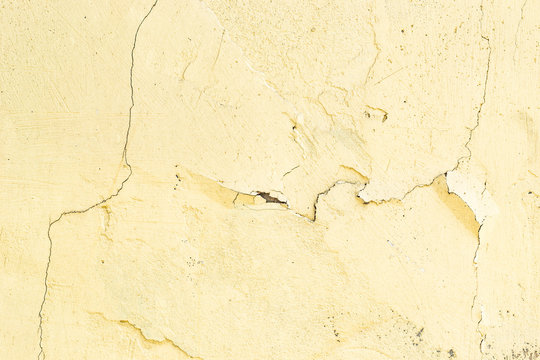 old yellow paint on a stone wall