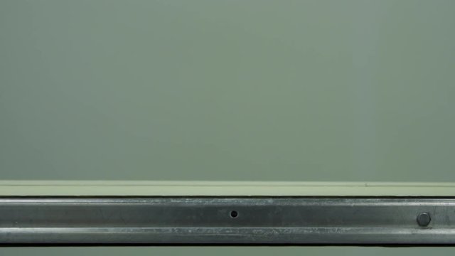 Sterilized clogged plastic bottles with medicine on the conveyor belt at the plant for the production of medical products and medicines