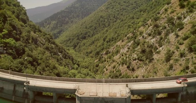 Aerial view of a bridge for cars that crosses the Plastira lake in Greece.