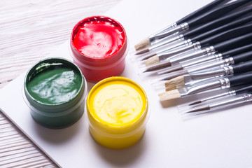 Set of  opaque watercolor and brushes