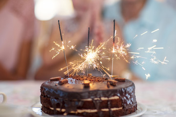 Chocolate birthday cake with sparklers