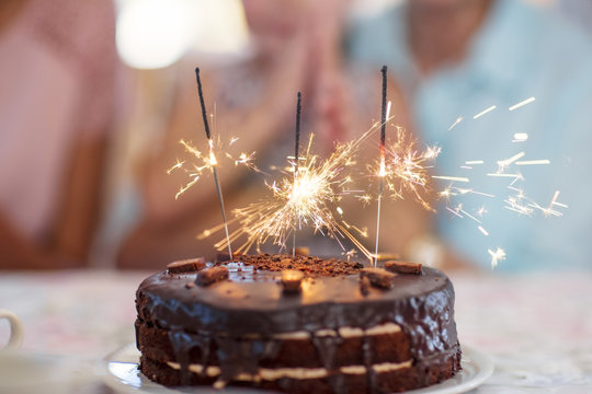 Chocolate birthday cake with sparklers