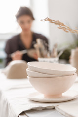 Cropped image of young woman making earthen pot