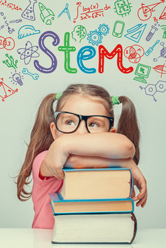 STEM word and symbols over beautiful cute little girl with thick books. modern education concept