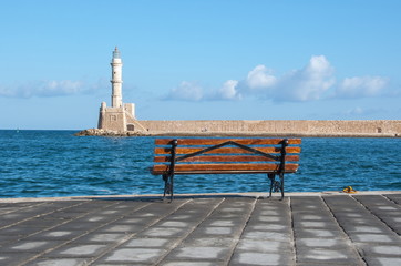 Chania beacon and bench on promenade at sea, Crete, Greece