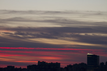 Sunset over the city. Twilight and high-rise buildings