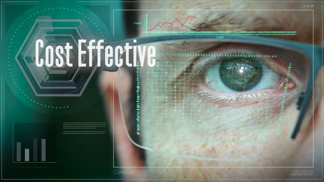 A close up of a businessman eye controlling a futuristic computer system with an Cost Effective concept.