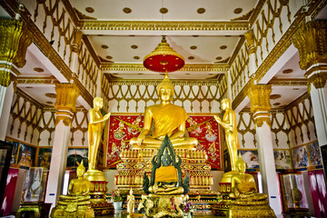 buddha statue and blue sky at Wat Phai Rong Wua, Suphanburi, Thailand.
