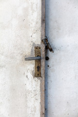 old white wooden door with a closed padlock
