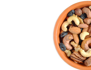 Nuts and raisins in a Cup on a white background isolate healthy food beneficial trace elements nuts