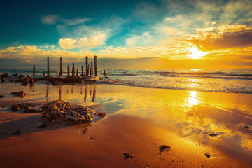 Port Willunga beach with jetty pylons at sunset