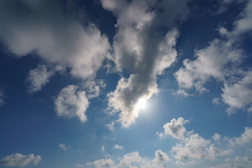 The sunny sky with white soft clouds image