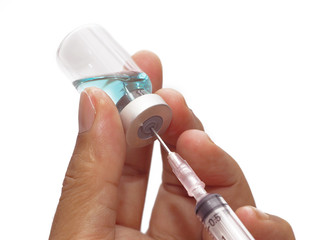 Man hand holding syringe and blue medicine vial. prepare for injection , isolated on white...