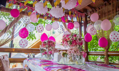 Pink girl birthday party with decorated table