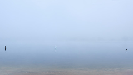 Fog in the autumn over the lake.
