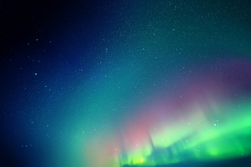 Night starry sky. Northern lights. Blue green aurora borealis