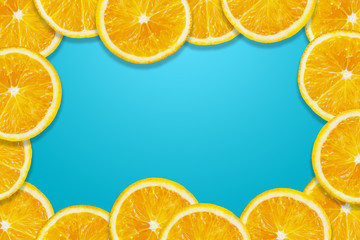 Orange fruit slice around blue background with copy space illustration