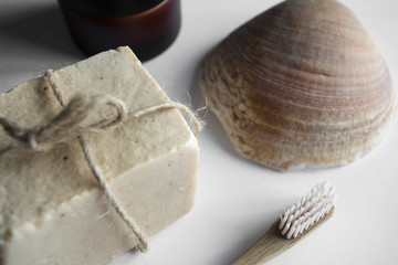 Natural soap and cream near a shell