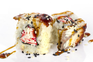 Sushi rolls japanese food isolated on white background.California Sushi roll with tuna, vegetables and unagi sauce closeup.Japanese Restaurant Menu.