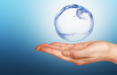 Water figure with human hand isolated